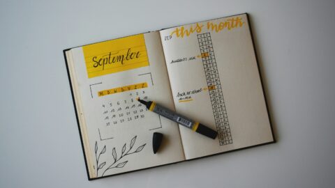 Calendar with pen on top